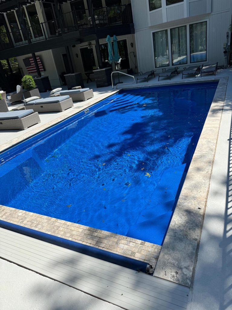 Rectangular fiberglass pool with sun loungers - Pools By York