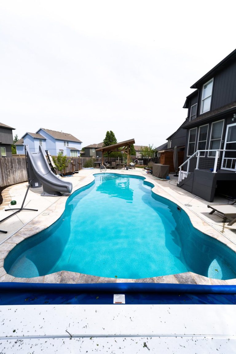 Freeform fiberglass pool with slide - Pools By York
